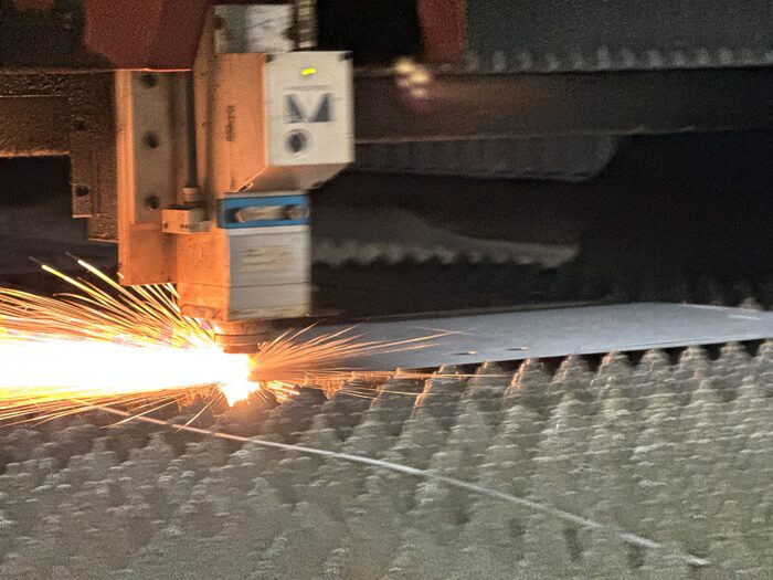 Alta-speed fiber laser cutting metal from coil with sparks