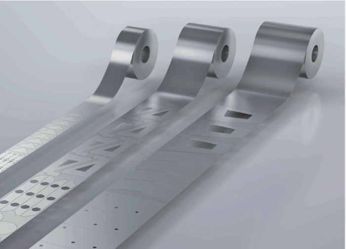 Multiple steel coils with laser-cut parts — scalable production